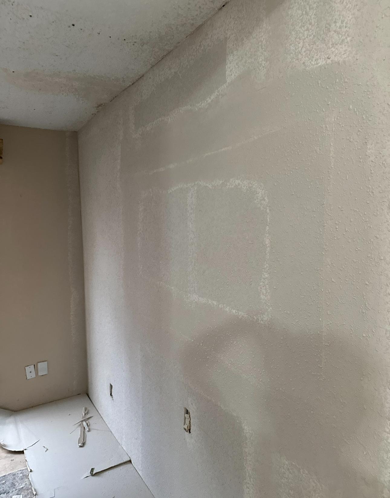 Fresh drywall install with skim coat ready for texture